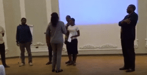 An image of an on-going role play by staff undergoing customer experience training